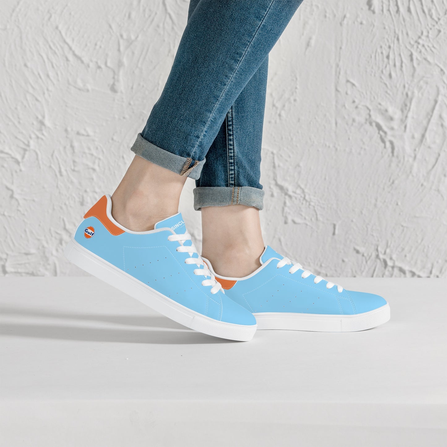 Gulf Racing sneakers worn by model - a perfect combination of motorsports heritage and modern street style.